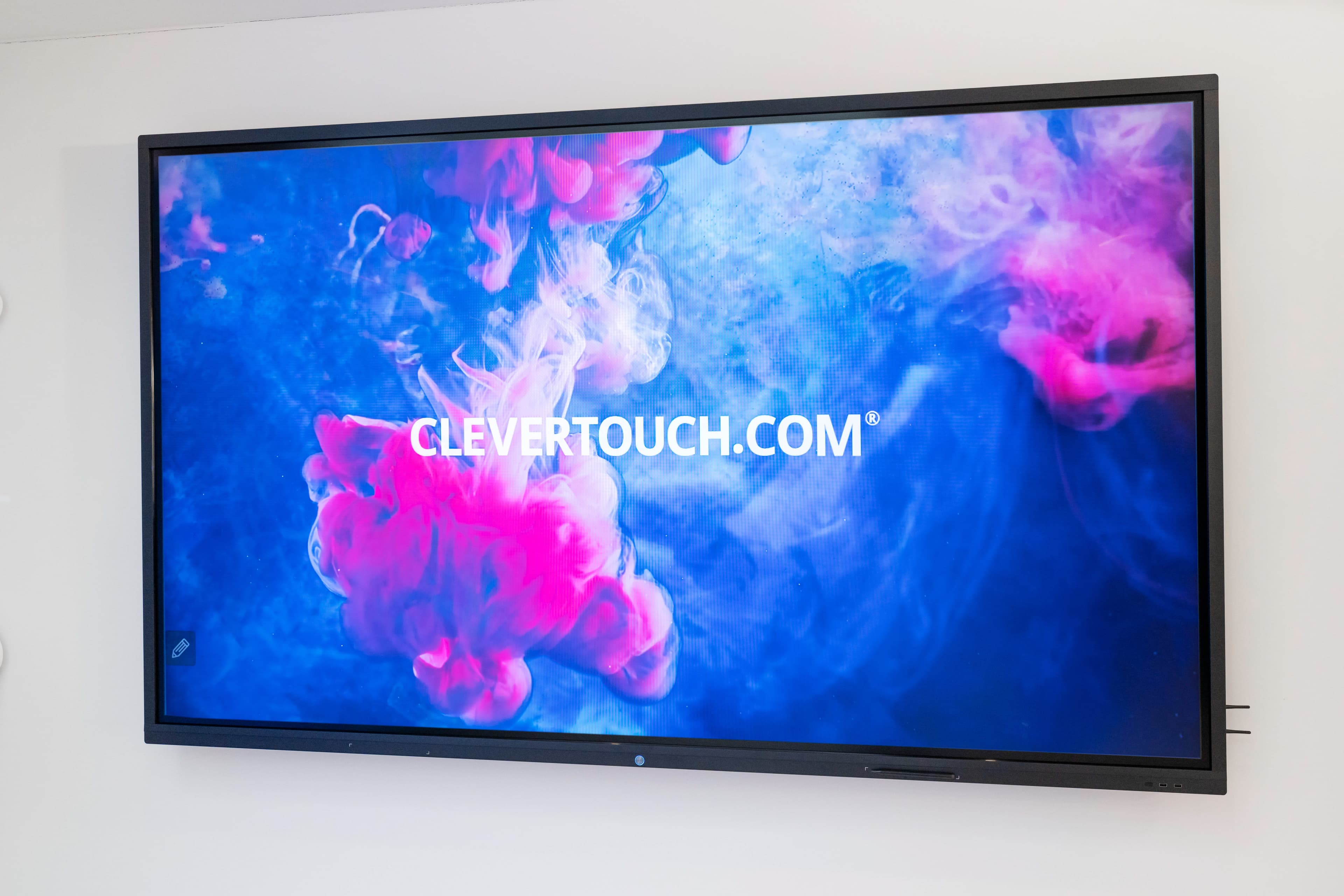 Clevertouch 98" Pro Series interactive display angled front view showing branded Clevertouch splash screen (generic chassis image; screen content not size-specific)