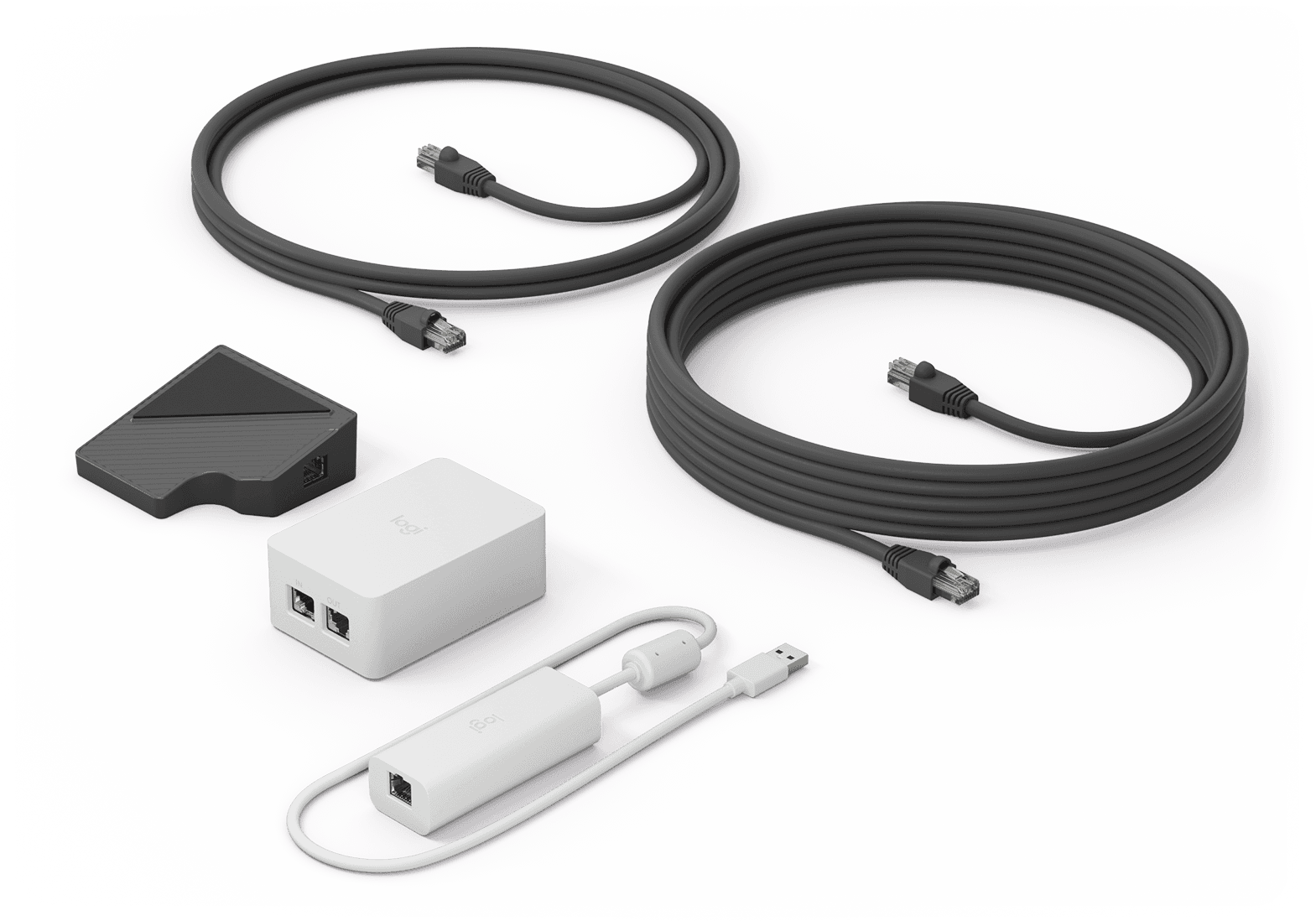 Logitech Cat5e Kit for Tap — the Tap receiver, dongle transceiver, power supply and two coiled Cat5e cables laid out on a white background